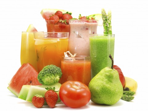 Juices, Smoothies, and Fruits & Veggies Arranged on a White Background