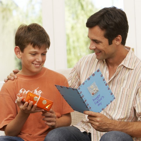 Son Giving Father a Card