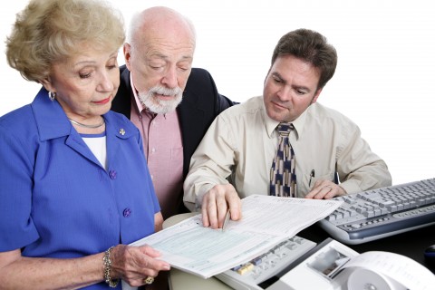 An Elderly Couple Checking Over Their Finances with an Accountant