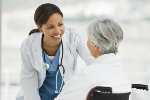 A Nurse Talking with an Elderly Patient