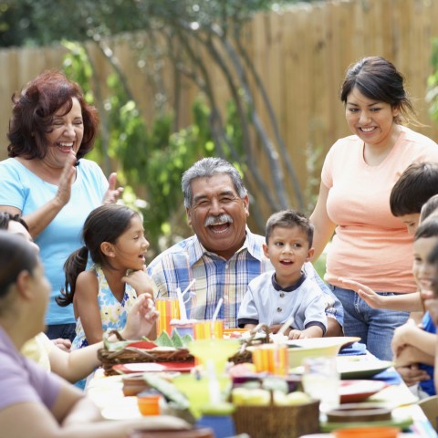 Family Laughing Around a Table