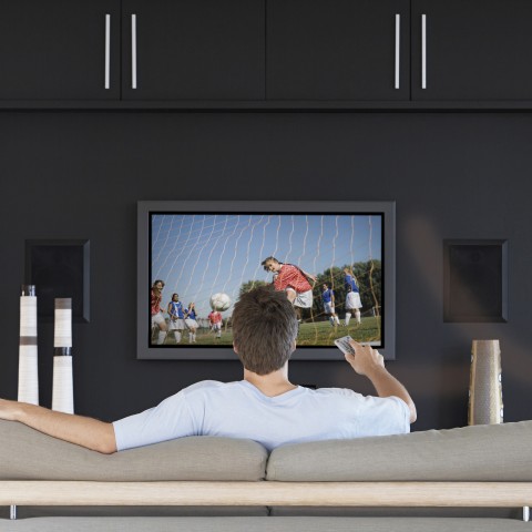 A Man Watching Soccer on TV