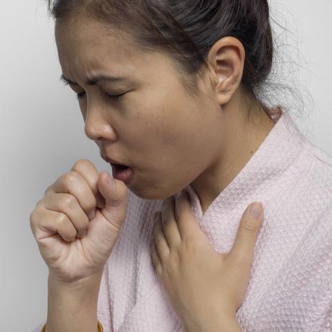 Young Women Coughing