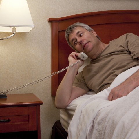 Man in Bed on the Phone