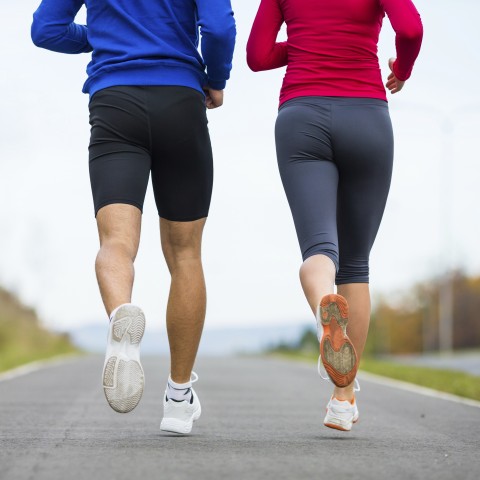 Two People jogging on the Road Together