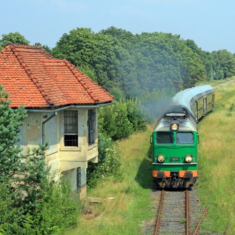 A Train Passing A House