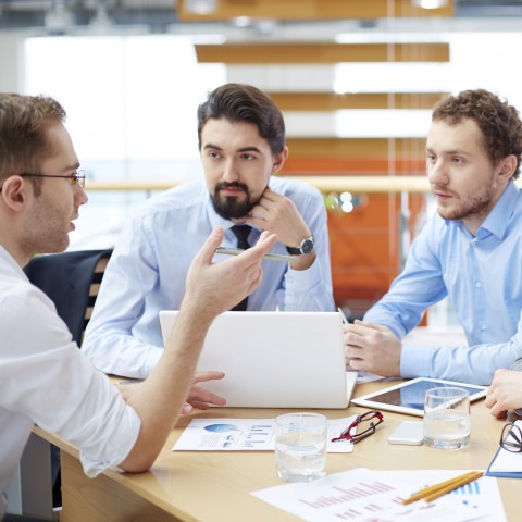 Three Businessmen Making Negotiations