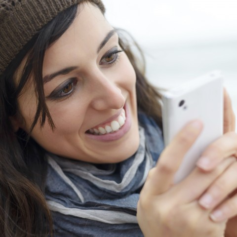 A Woman Texting on Her Phone