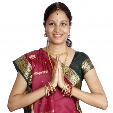 Woman Making a Traditional Greeting