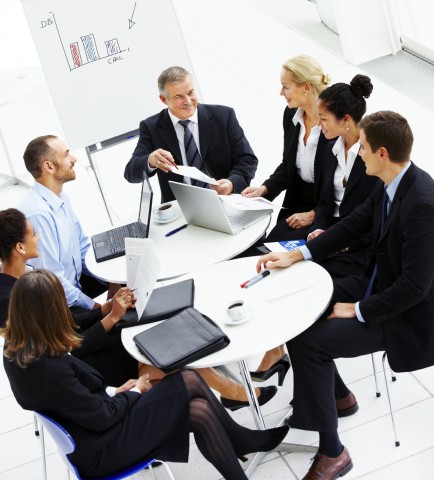 Several Business People Dressed in Formal Business Attire