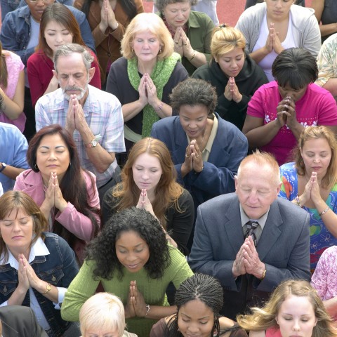 A Multiracial Crowd Praying.