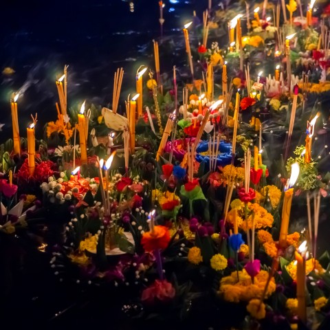 Lotus-shaped Boats with Candles Floating Down the River for Loy Krathong