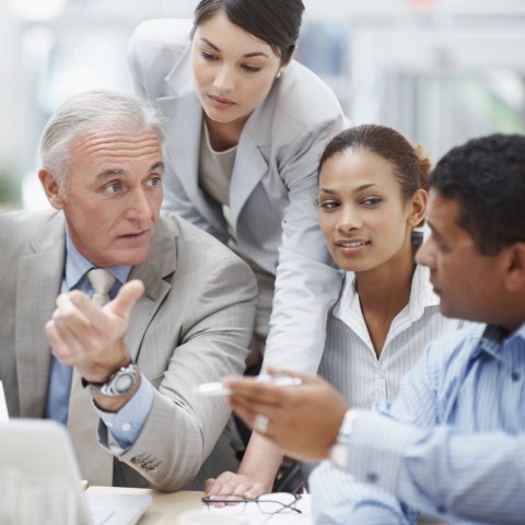 Four Business Professionals Having a Meeting at Work