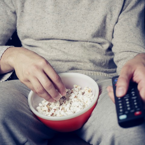 Someone Watching TV with a Bowl of Popcorn