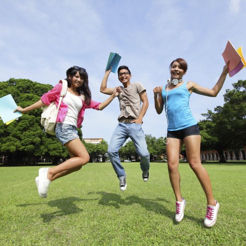 A Trio of College Students Having Fun While Learning