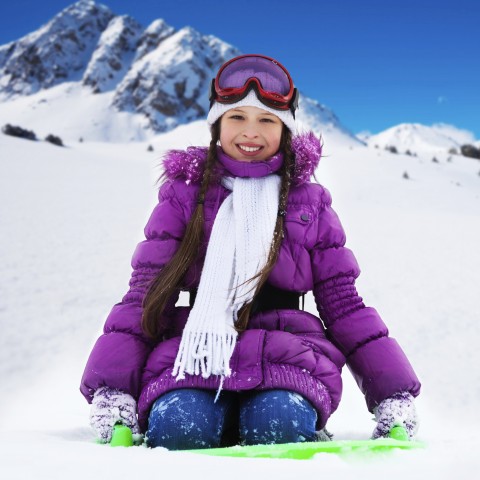 Woman in Snow Wearing Purple Coat