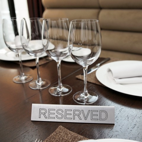 Table with Reserved Sign On It