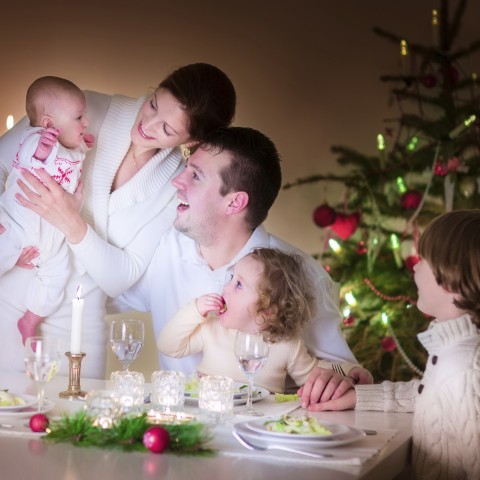 A Married Couple with Three Children Celebrating a Holiday