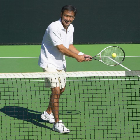 An Older Man Playing Tennis