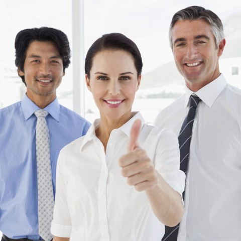 A Businesswoman Giving a Thumbs-up Sign