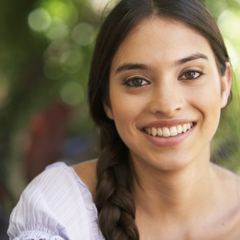 A Woman Smiling at the Camera