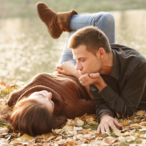 A Man and Woman Flirting During Autumn