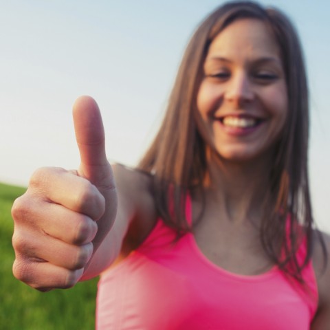 A Woman Giving a Thumbs-Up Sign