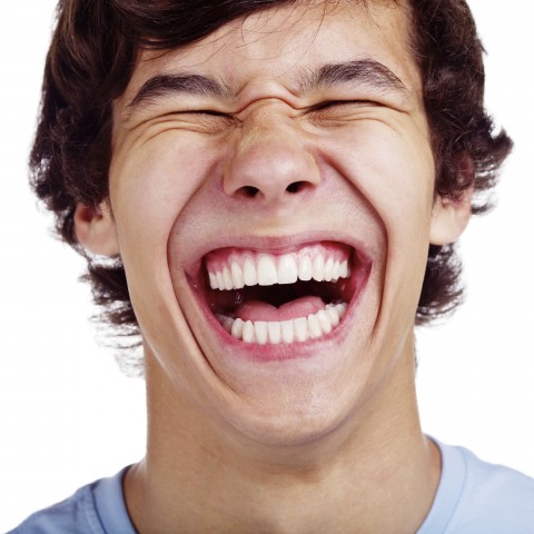 A Young Man Laughing Heartily