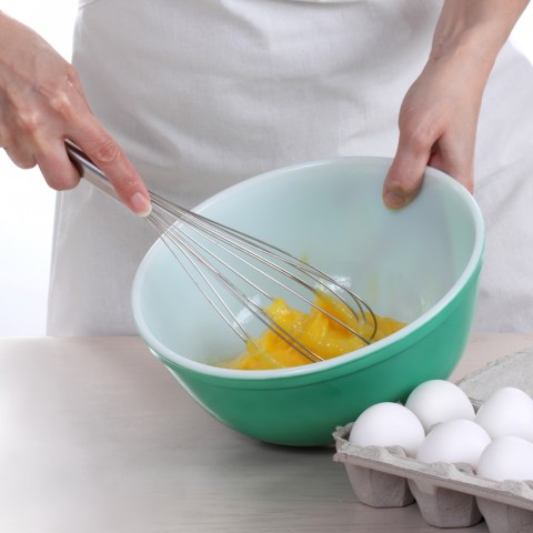 Someone Whisking Eggs in a Bowl