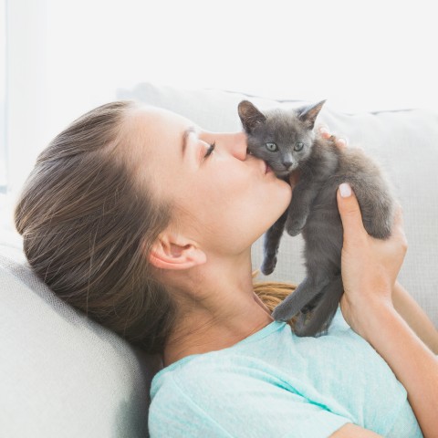 Woman Cuddling Cat