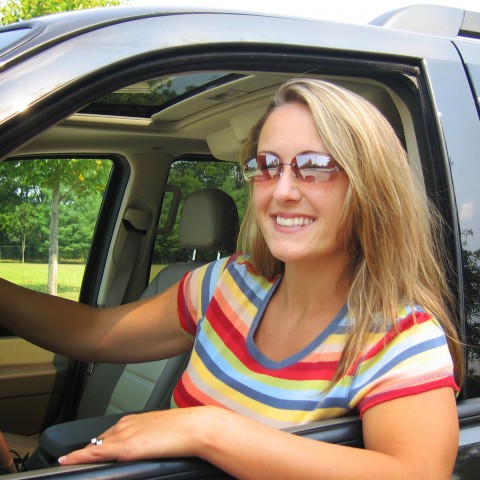 Woman Leaning Out of Car