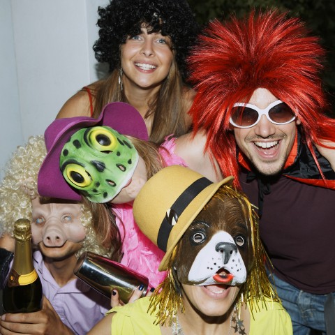 Partygoers Wearing Costumes and Animal Masks.