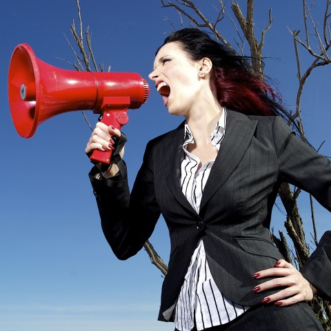 Woman Speaking Through Airhorn