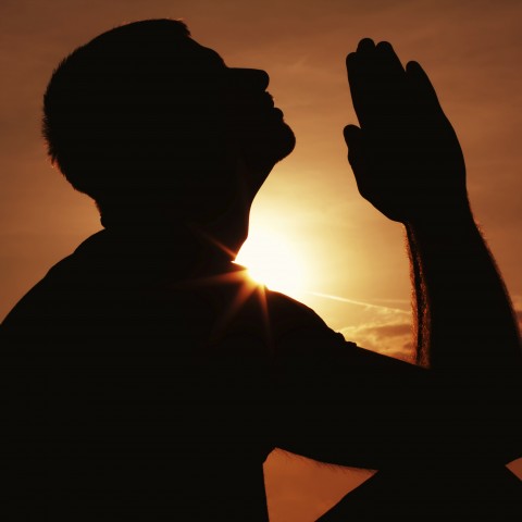 Silhouette of Man Praying for Repentance