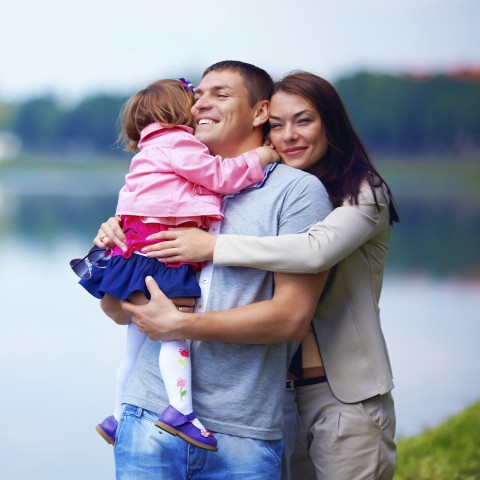 Family Walking by a Lake