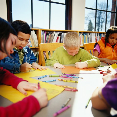Young Schoolchildren Engrossed in a Creative Drawing Activity in Class.