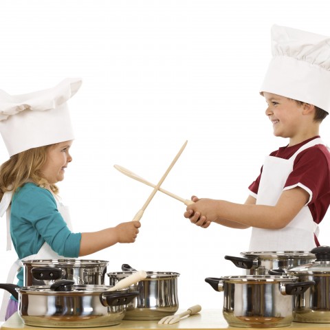 Brother and Sister Play Fighting in the Kitchen