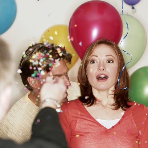 A Woman Astounded at a Surprise Party for Her Birthday