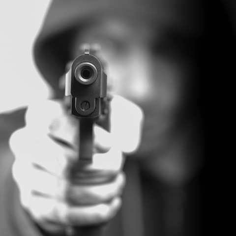 Hooded Man Pointing Gun