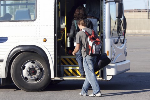 People Boarding a Bus