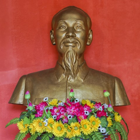 Ho Chi Mihn statue with flowers