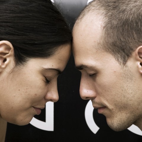 Man and Woman Touching Heads