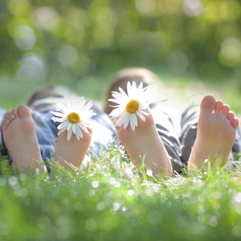 Two Children's Feet with Flowers