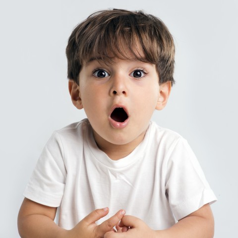 A Young, Surprised-looking Boy Saying Wow!