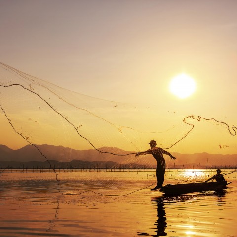 Two Fishermen Casting Their Nets