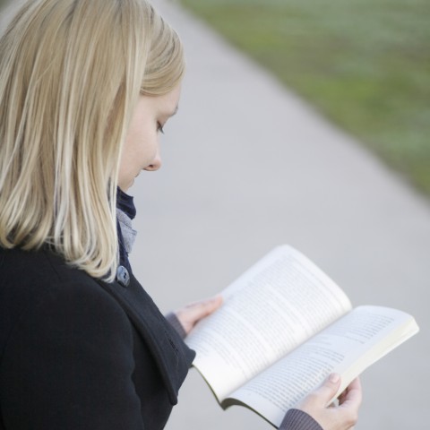 Blonde Girl Reading a Book