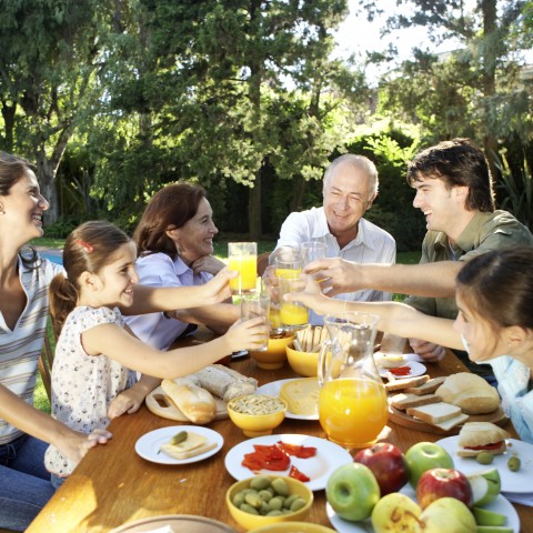 A Family Enjoying a Meal Outside Together