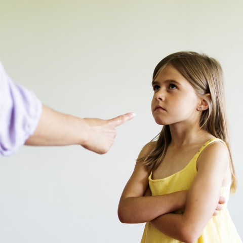 Girl Being Scolded by Parent