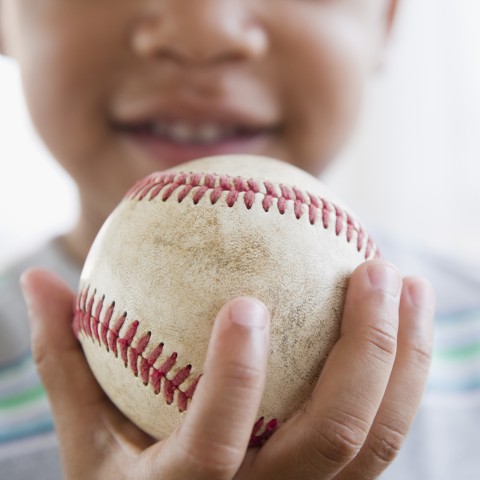 Child Holding Baseball