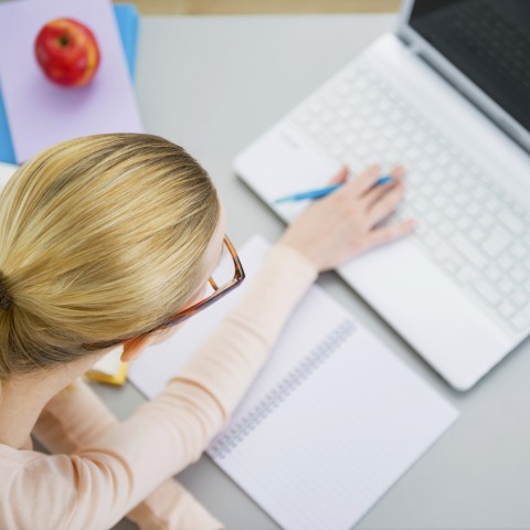 A Woman Studying on Her Laptop